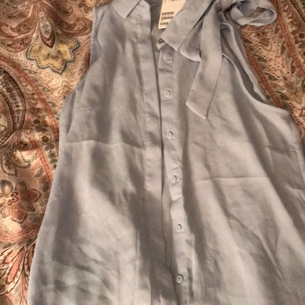 H&M’s light blue silky blouse with bow